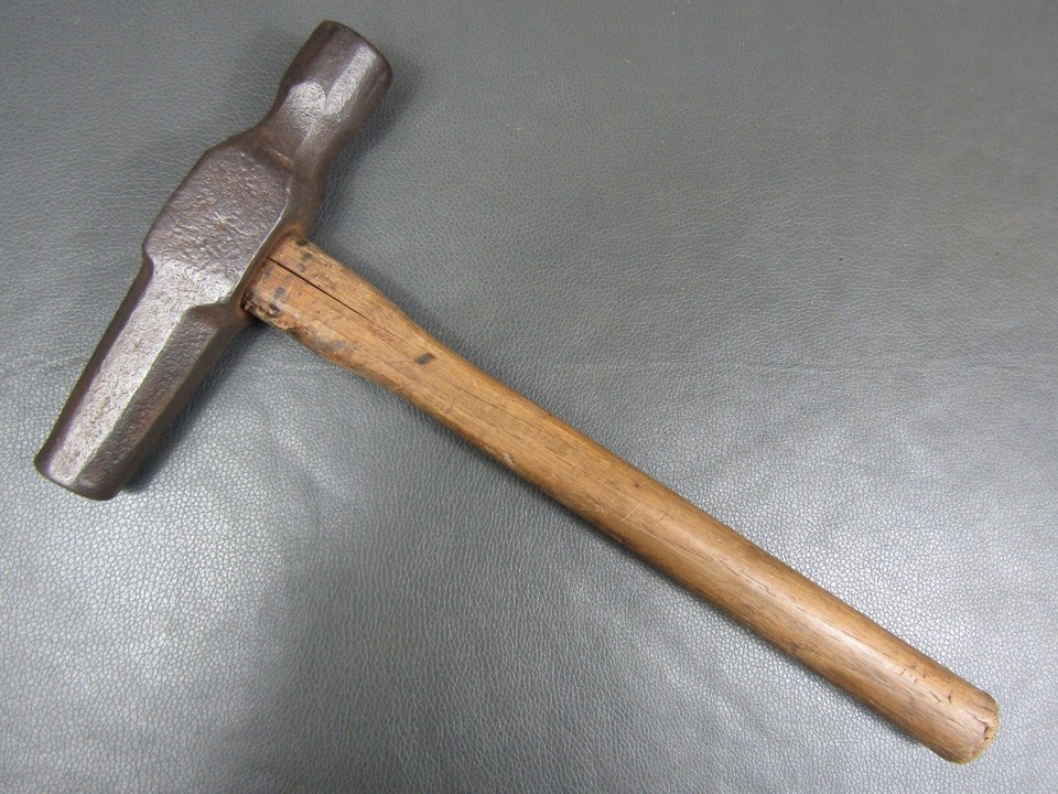 A 2.5lb dog-head blacksmith's hammer is a jaw-dropper — the sculpted animal-form head is a centuries-old decorative tradition that makes this as much art object as tool.