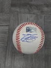 MIKE MOUSTAKAS AUTOGRAPHED BASEBALL ON USED MINOR LEAGUE BALL (SIDE).