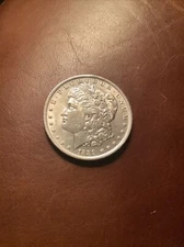 1889 O Morgan silver dollar . Unc GreySheet price $ 340