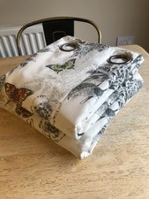 Eyelet curtains butterfly design  width 64" each panel 128" total  by 70" drop