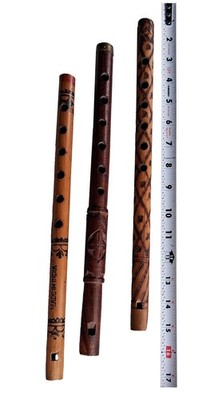 three decorative flutes/whistles