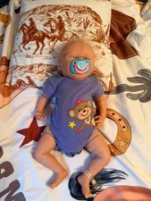 Sleeping Baby Doll Cloth Body Eyes Closed Blonde Straight Hair Light Complexion
