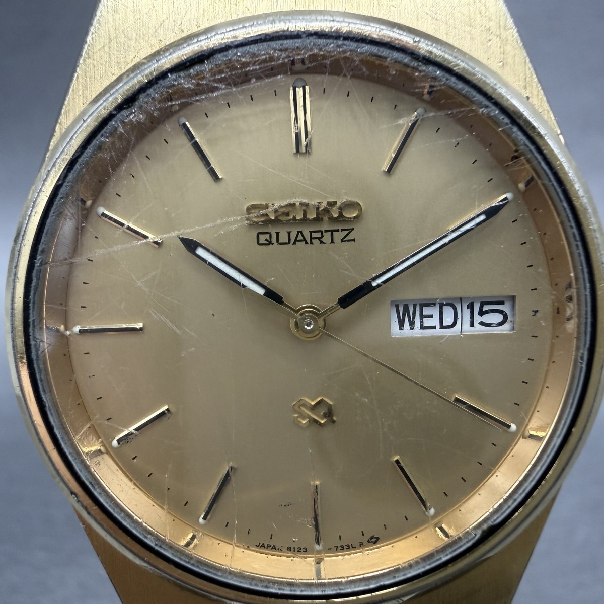 Seiko SQ Watch Men 34mm Champagne Dial Gold Tone Daydate 8123-7240