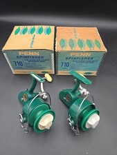 Two very good working Penn 710 spinning reels in boxes, spare spool, etc