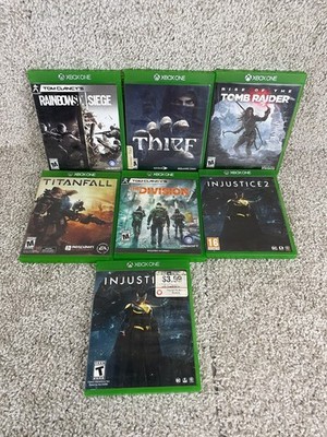 Lot of 7 Xbox One RainbowSix Thief Tomb Raider TitanFall The Divisions Injustice