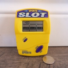 RADICA SPORTS POCKET SLOTS CASINO HANDHELD LCD ELECTRONIC GAME 1990s YELLOW MINI