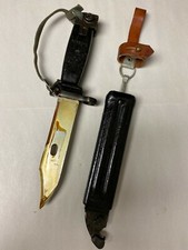 YUGOSLAVIAN BLACK BAYONET WITH LEATHER FROG WRIST BAND AND SCABBARD.