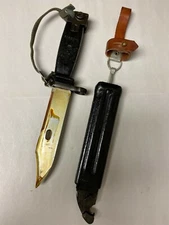 YUGOSLAVIAN BLACK BAYONET WITH LEATHER FROG WRIST BAND AND SCABBARD. 