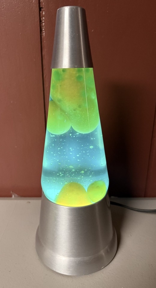 A vintage Blip lava lamp with blue liquid and yellow-green wax — a genuine funky retro relic that's harder to find working than modern reproductions.