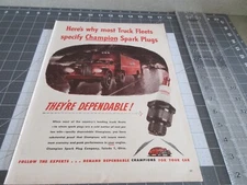 1946 Champions Spark Plugs Car Parts Truck Fleets Rain Vintage Print Ad