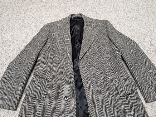 Gray wool vintage USA-made TWEED donegal overcoat with notch lapels, front button closure, and two front flap pockets.