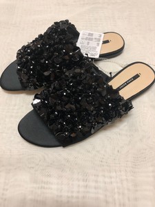 black embellished flat shoes