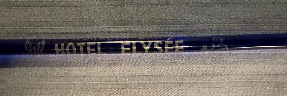 A cobalt blue swizzle stick from the legendary Hotel Elysée Monkey Bar — NYC nightlife history you can hold in your hand.