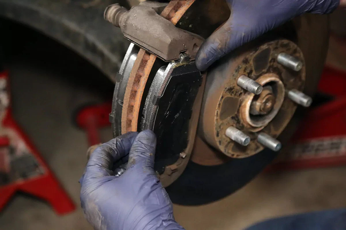 Installing a brake pad to a brake rotor.