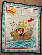 Handmade Noah's Ark Baby Quilt in bright blue with red jungle animal backing