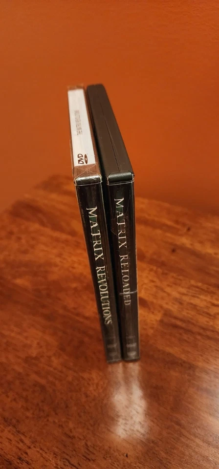The Matrix Revolutions DVD New and Sealed, Reloaded DVD used. Foto 3 de 4