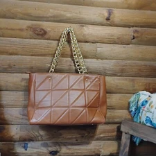 brown quilted leather handbag by i Medici Firenze, featuring a gold chain strap