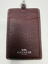 Coach Women's ID Lanyard in "Wine Multi," crafted from refined pebble leather.