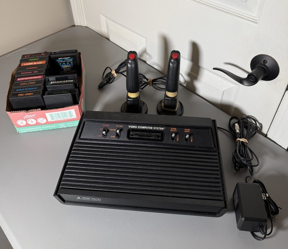 A complete Atari 2600 bundle with 15 games — the granddaddy of home gaming, fully functional and dripping with 1970s/80s nostalgia.