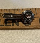 Vintage N.Y.K. Line embossed flag badge on a tie pin/clip-Maritime advertising — photo 1