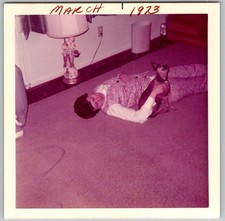 Vtg Color Snapshot Cute Woman Lying On Carpet Floor Holding Small Dog Pet 1973