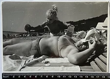 Pretty young woman in swimsuit on the beach Lady in women's bikini Hairy Armpits