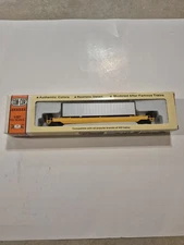 CON-COR, HO  Single undecorated well car with container.