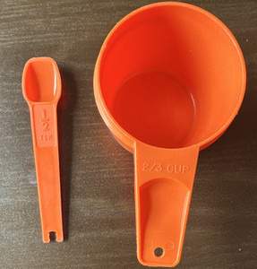 Tupperware Orange Plastic Measuring Set 2/3 Cup & 1/2 tsp Spoon, 2pc