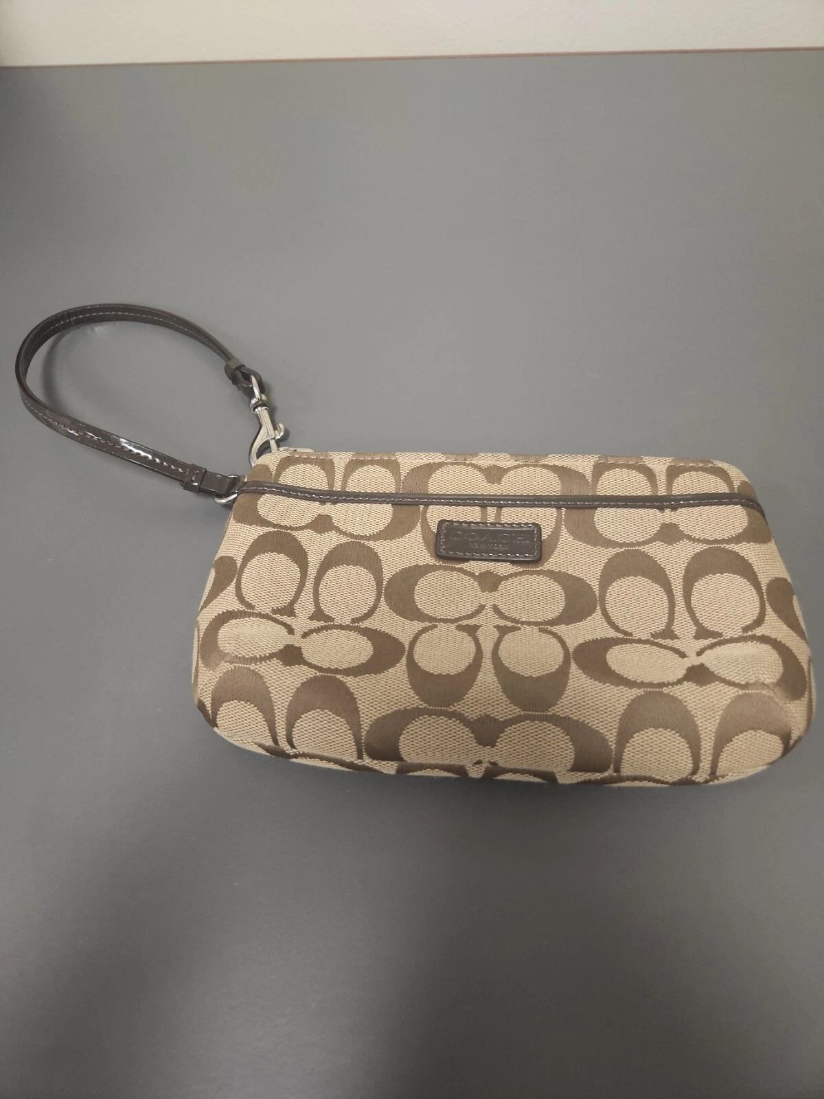 Portafoglio da polso firmato Coach Park pochette