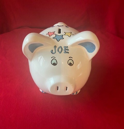 Large piggy bank with the name JOE