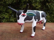 Hand painted, folk art wooden cow figurine