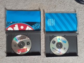 Sega CD ROM entertainment system for genesis with AC adapter and 2 games