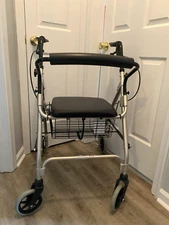 Lumex 4 wheeled Foldable Walker Adjustable Handles 300 lbs capacity with basket