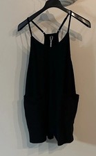 NWT black shorty romper with adjustable spaghetti straps and front pockets