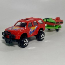 Faie Toyota Hilux Surf 4Runner 1:64 modellino pressofuso da collezione SUV rosso