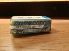 Toy greyhound Bus Tin Made In Japan,3” L, One Tire Missing. Works