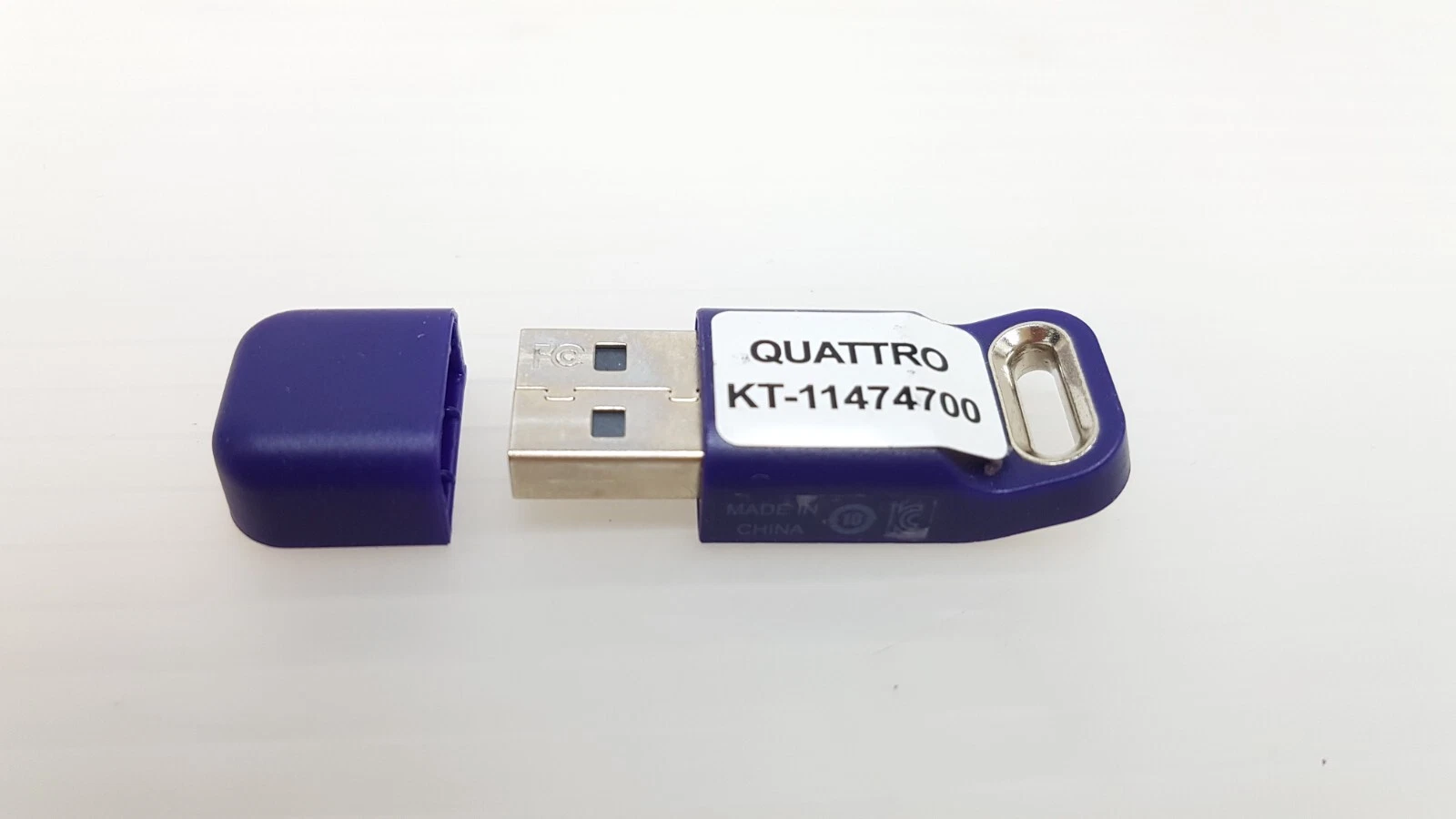 KT-11474700 Quattro key with cap off, USB-A plug with FCC mark