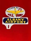 New ListingVINTAGE "LEARN TO FLY, ALBANY AIRPORT" METAL LICENSE PLATE TAG TOPPER, NICE