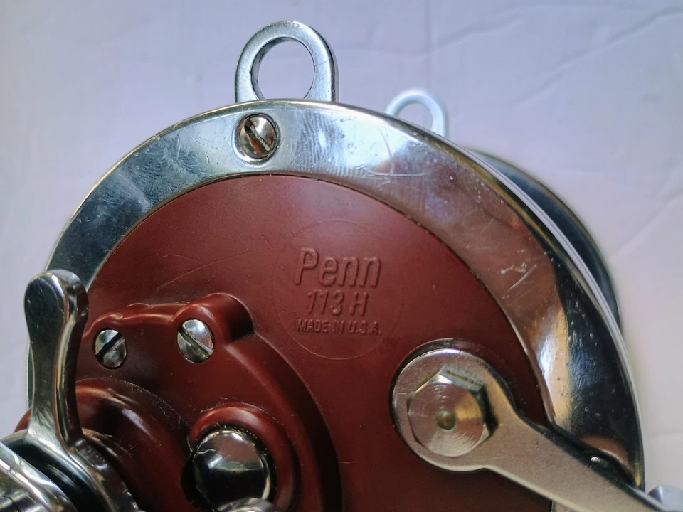 Carrete de baitcasting Penn Senator 113H 4/0 con postes laterales Newell reparado Foto 4 de 4