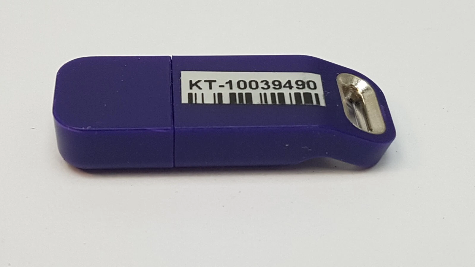 Side view of the Lumenis KT-10039490 USB HASP key with metal key ring