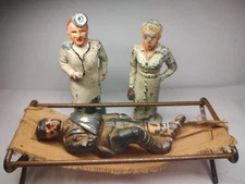 Barclay,Manoil Doctor,Nurse Wounded On Cot