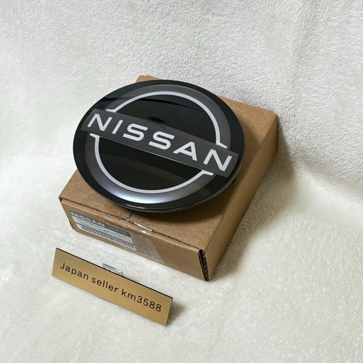Nissan Genuine New design CI Front Grille Radar Emblem 62890-7FW0B