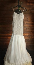 Adrianna Papell sleaveless beaded floor-length formal gown.