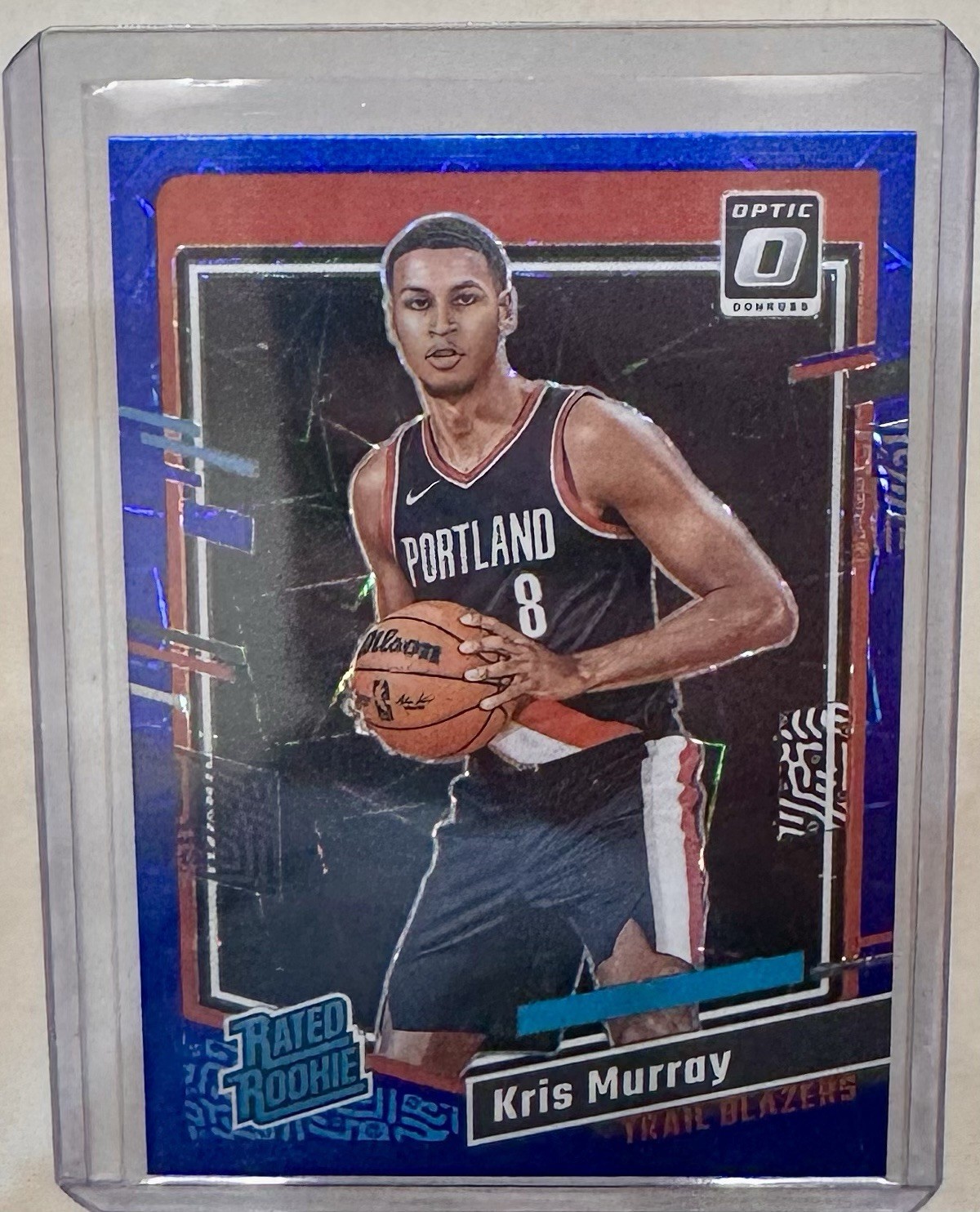 2023-24 Panini  Optic - Rated Rookie Blue Velocity Prizm #213 Kris Murray (RC)