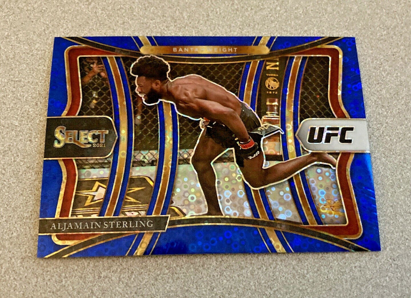 2021 Panini Select UFC Premier Level Blue Disco Prizm #151 Aljamain Sterling /99