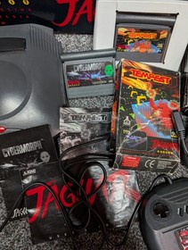 Atari Jaguar Console boxed with 2 controllers and 2 games manuals for everything