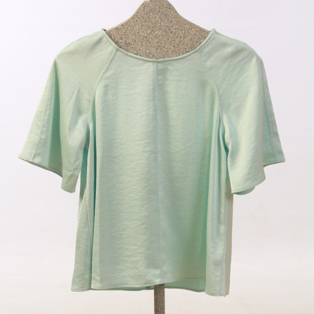 Turquoise silk Anthropologie blouse with playful back detail