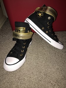 gold and black high tops