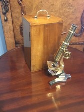 A FINE QUALITY ANTIQUE MAHOGANY CASED BRASS MICROSCOPE ,EARLY 1900’s.