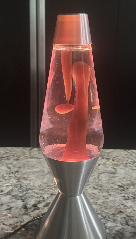 A *fat* 52oz recapped globe lava lamp with moody brown lava and purple liquid — oversized, professionally recapped, and genuinely striking.